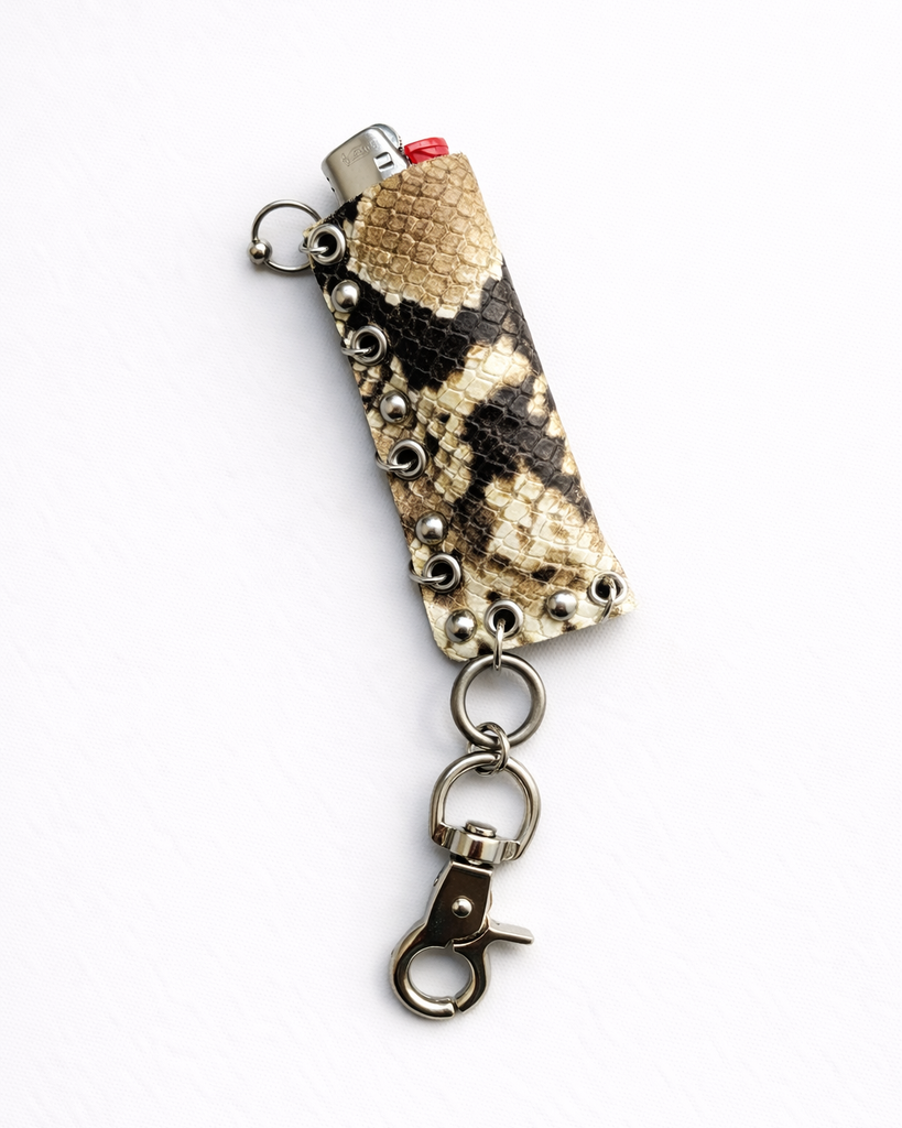 Pierced snakeskin lighter case